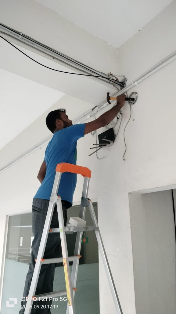 Field Technician Installing Fiber Cabling and Conduit